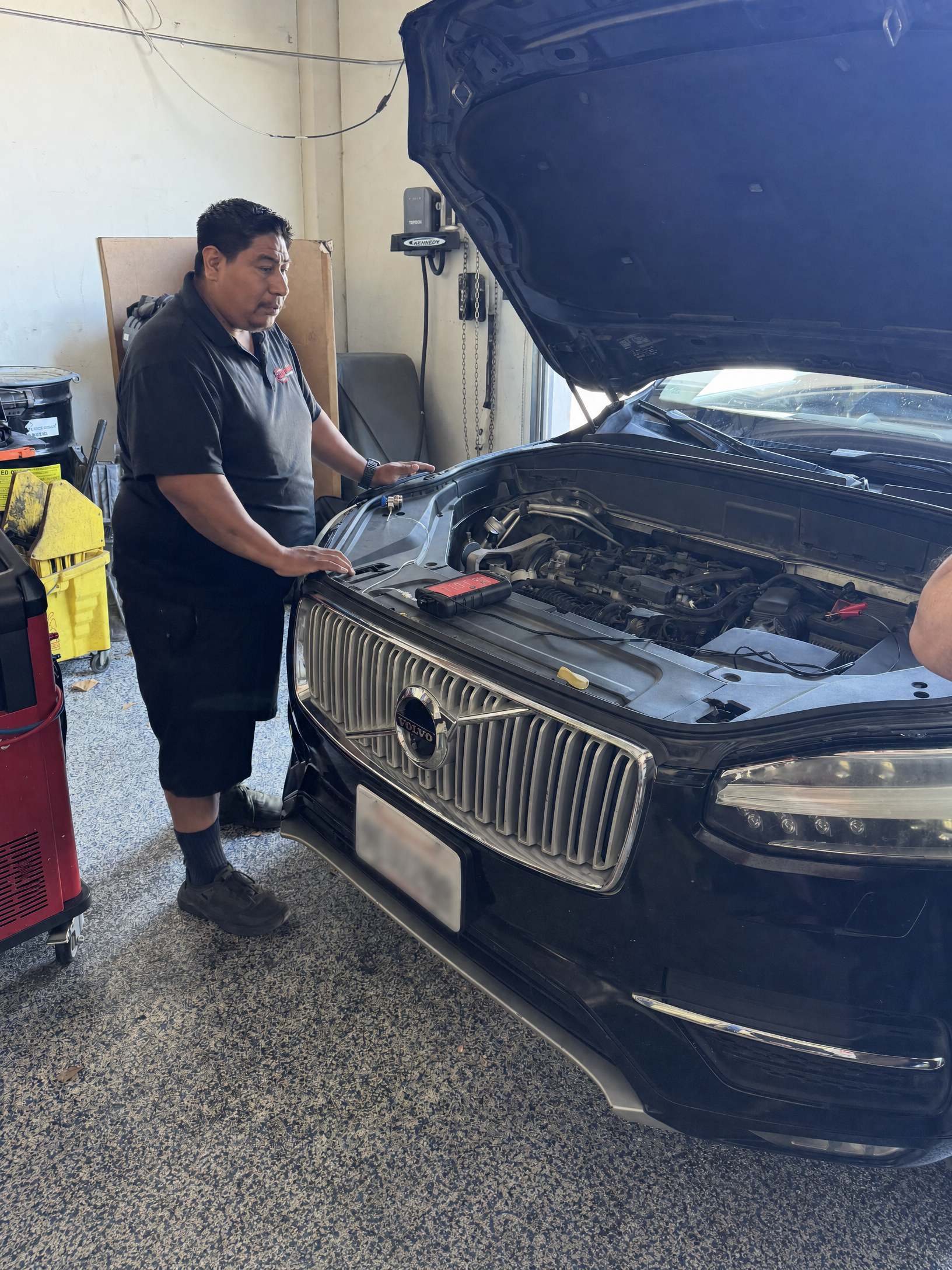 Oscar Gomez working on a vehicle at Master Automotive Training lab